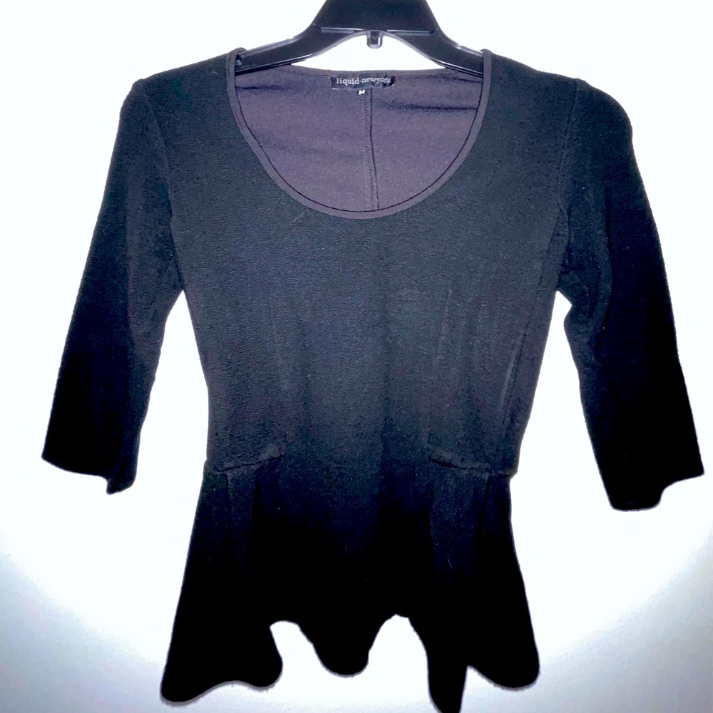 Long sleeve peplum top perfect with jeans or a pencil skirt.